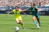 Denver Summit FC forward Yazmeen Ryan, right, drives past Washington Spirit defender Lucia Di Guglielmo in the second half of an NWSL soccer match Saturday, March 28, 2026, in Denver. (AP Photo/David Zalubowski)