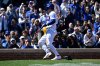Chicago Cubs' Nico Hoerner scores during the second inning of a baseball game against the Washington Nationals, Saturday, March 28, 2026, in Chicago. (AP Photo/Matt Marton)