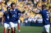 France forward Désiré Doué (20) celebrates with Lucas Digne (3) after scoring the opening goal during the international friendly soccer match between Colombia and France in Landover, Md., Sunday, March 29, 2026. (AP Photo/Nick Wass)