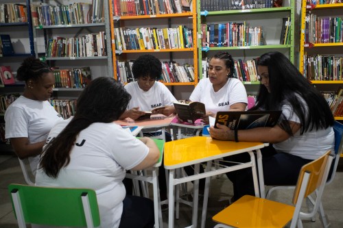 Incarcerated women read books in the library of the Djanira Dolores de Oliveira women's prison in Rio de Janeiro, Wednesday, March 25, 2026. (AP Photo/Bruna Prado)