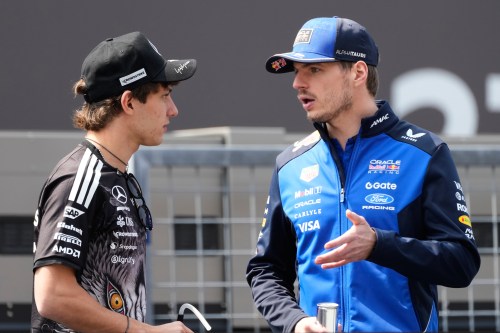 Red Bull driver Max Verstappen, right, of the Netherlands and Mercedes driver Kimi Antonelli of Italy talk during the drivers parade ahead of the Japanese Formula One Grand Prix at Suzuka in central Japan, Sunday, March 29, 2026. (AP Photo/Eugene Hoshiko)