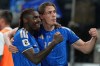 Italy's Moise Kean, left, and teammate Francesco Pio Esposito, right, celebrate after Kean scored his side's second goal during the World Cup qualifying play-off soccer match between Italy and Northern Ireland, in Bergamo, Italy, Thursday, March 26, 2026. (AP Photo/Antonio Calanni)
