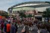 Baseball fans mingle outside of Chase Field before a opening-day baseball game between the Arizona Diamondbacks and Detroit Tigers Monday, March 30, 2026, in Phoenix. (AP Photo/Darryl Webb)