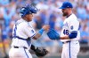Kansas City Royals catcher Salvador Perez (13), left, and relief pitcher John Schreiber (46) meet on the mound during the ninth inning of a baseball game against the Minnesota Twins, Monday, March 30, 2026, in Kansas City, Mo. (AP Photo/Charlie Riedel)
