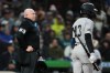 Home plate umpire Mike Estabrook (83) reacts as New York Yankees' Jazz Chisholm Jr. challenges a call during the fourth inning of a baseball game against the Seattle Mariners, Monday, March 30, 2026, in Seattle. (AP Photo/Lindsey Wasson)