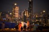 Members of a family who fled Israeli shelling in southern Lebanon warm themselves by a bonfire next to tents used as shelters in Beirut, Lebanon, Tuesday, March 31, 2026. (AP Photo/Emilio Morenatti)