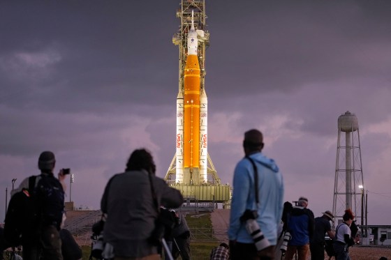 Photographers set up remote cameras near NASA's Artemis II moon rocket at the Kennedy Space Center on Tuesday, in Cape Canaveral, Fla. (Chris O'Meara / The Associated Press)