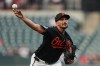Baltimore Orioles starting pitcher Zach Eflin delivers during the first inning of a baseball game against the Texas Rangers, Tuesday, March 31, 2026, in Baltimore. (AP Photo/Stephanie Scarbrough)