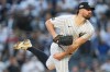 FILE - New York Yankees pitcher Carlos Rodón delivers against the Boston Red Sox during the first inning of Game 2 of an American League wild-card baseball playoff series, Oct. 1, 2025, in New York. (AP Photo/Yuki Iwamura, File)