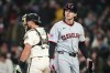 Cleveland Guardians' Chase DeLauter walks to the dugout after striking out against Seattle Mariners starting pitcher Emerson Hancock during the first inning of a baseball game, Sunday, March 29, 2026, in Seattle. (AP Photo/Lindsey Wasson)