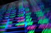A board above the trading floor of the New York Stock Exchange with stock symbols is shown in this image, Tuesday, July 1, 2025. (AP Photo/Richard Drew)