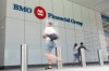 People make their way past the Bank of Montreal building in the Financial District of Toronto, Monday, Aug. 14, 2023. THE CANADIAN PRESS/Spencer Colby