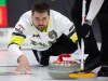Matt Dunstone, skip of Team Manitoba-Dunstone releases his stone during the 1 vs. 2 playoffs at the Montana's Brier Canadian men's curling championship, in St. John's, N.L., on Saturday, March 7, 2026. THE CANADIAN PRESS/Paul Daly