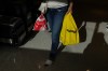 A customer clutches their reusable bag as they leave a No Frills Grocery store in Toronto, Thursday, May 30, 2024. THE CANADIAN PRESS/Chris Young