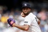 FILE - New York Yankees pitcher Luis Gil (81) throws to first base during the second inning of a baseball game against the Toronto Blue Jays, Sept. 6, 2025, in New York. (AP Photo/Adam Hunger, File)