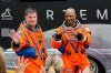 Astronauts, Mission Specialist Jeremy Hansen, of Canada, and Pilot Victor Glover wave to family members as they leave the Operations and Checkout Building for a trip to Launch Pad 39-B and a planned liftoff on NASA's Artemis II moon rocket at the Kennedy Space Center Wednesday, April 1, 2026, in Cape Canaveral, Fla. (AP Photo/Chris O'Meara)