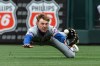 New York Mets' right fielder Carson Benge dives but can't make the catch on a fly ball which allowed the St. Louis Cardinals to score the winning run in the 11th inning of a baseball game, Wednesday, April 1, 2026, in St. Louis. (AP Photo/LG Patterson)