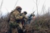 In this image made from video provided by Russian Defense Ministry Press Service on Tuesday, March 31, 2026, Russian soldiers fire a grenade launcher towards Ukrainian positions on an undisclosed location in Ukraine. (Russian Defense Ministry Press Service via AP)