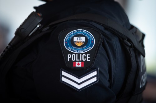 An organized crime agency police patch is seen on the shoulder of a member of the Combined Forces Special Enforcement Unit of B.C. during an RCMP news conference in Burnaby, B.C., Monday, May 10, 2021. THE CANADIAN PRESS/Darryl Dyck