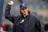 New Jersey Devils' Jack Hughes practices ahead of his first pitch before a home-opener baseball game between the New York Yankees and the Miami Marlins, Friday, April 3, 2026, in New York. (AP Photo/Yuki Iwamura)