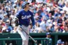 Los Angeles Dodgers' Shohei Ohtani (17) watches his three-run home run during the third inning of an baseball game against the Washington Nationals, Friday, April 3, 2026, in Washington. (AP Photo/Terrance Williams)