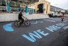 A cyclist rides across the new crosswalk at Royal Alexandra Hospital in Edmonton, Thursday, Sept. 29, 2022. THE CANADIAN PRESS/Jason Franson