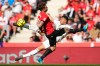 Real Madrid's Kylian Mbappe shoots by Mallorca's Pablo Maffeo during a La Liga soccer match between Mallorca and Real Madrid in Palma de Mallorca, Spain, Saturday, April 4, 2026. (AP Photo/Jose Breton)