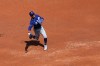 Los Angeles Dodgers shortstop Mookie Betts throws to first base for an out on a ball hit by Washington Nationals' Luis García Jr. during the first inning of a baseball game, Friday, April 3, 2026, in Washington. (AP Photo/Terrance Williams)