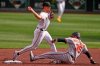 Pittsburgh Pirates shortstop Konnor Griffin gets the force out at second on Baltimore Orioles' Adley Rutschman (35) but fails to complete the double play on Dylan Beavers at first base during the second inning of a baseball game in Pittsburgh, Saturday, April 4, 2026. (AP Photo/Gene J. Puskar)