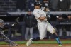 New York Yankees designated hitter Giancarlo Stanton hits a single during the eighth inning of a baseball game against the Miami Marlins, Saturday, April 4, 2026, in New York. (AP Photo/Heather Khalifa)