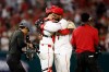 Los Angeles Angels catcher Logan O'Hoppe (14) and left fielder Jo Adell (7) embrace at the end of a baseball game against the Seattle Mariners, Saturday, April 4, 2026, in Anaheim, Calif. (AP Photo/Caroline Brehman)