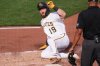 Pittsburgh Pirates' Jared Triolo scores on a double by Henry Davis off Baltimore Orioles pitcher Kyle Bradish during the second inning of a baseball game in Pittsburgh, Friday, April 3, 2026. (AP Photo/Gene J. Puskar)