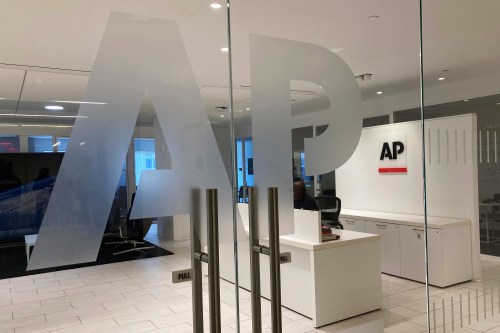 FILE - The Associated Press logo is shown at the entrance to the news organization's office in New York, July 13, 2023. (AP Photo/Aaron Jackson, File)