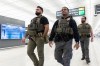 U.S. Immigration and Customs Enforcement's (ICE) agents patrol around the Washington Dulles International Airport, in Chantilly, Va., Tuesday, March 24, 2026. (AP Photo/Manuel Balce)