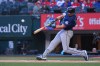 Seattle Mariners' Cal Raleigh connects on a solo home run off Texas Rangers starting pitcher Jacob deGrom during the first inning of a baseball game Monday, April 6, 2026, in Arlington, Texas. (AP Photo/Julio Cortez)