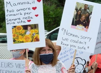 Family and friends of the residents that died from COVID-19 related causes take part in a memorial in front of the Residence Angelica seniors home Thursday, July 23, 2020 in Montreal. THE CANADIAN PRESS/Ryan Remiorz