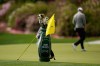 The golf bag of Rory McIlroy, of Northern Ireland, sits near the 13th hole as he putts during a practice round ahead of the Masters golf tournament at the Augusta National Golf Club, Tuesday, April 7, 2026, in Augusta, Ga. (AP Photo/Eric Gay)