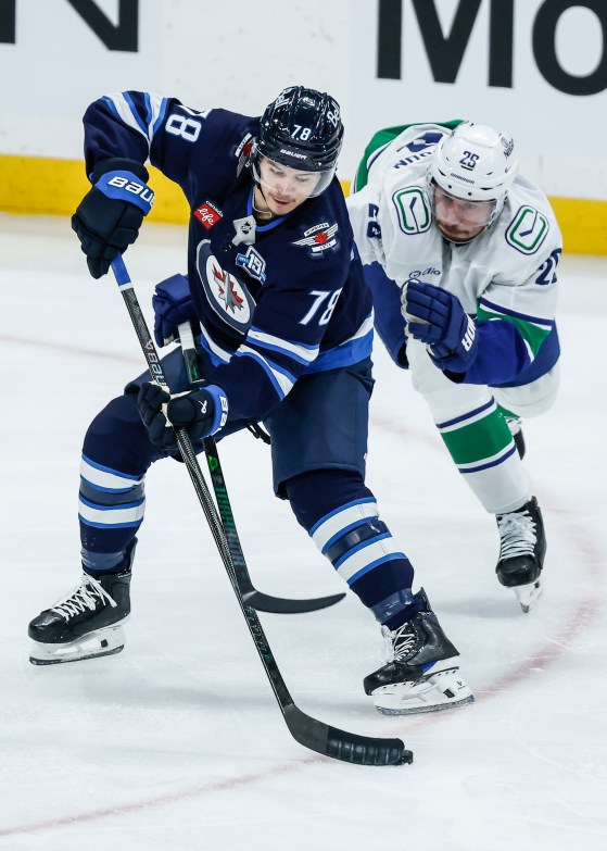 Vancouver Canucks' Marcus Pettersson (29) defends against Winnipeg Jets' Jacob Bryson (78) during the third period of Saturday's game. (John Woods / The Canadian Press files)