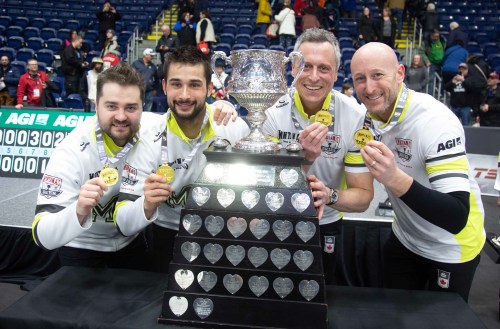 Team Manitoba-Dunstone, from left to right, Matt Dunstone,, Colton Lott , EJ Harnden, Ryan Harden with the Tankard and their gold medals at the Montana's Brier Canadian men's curling championship, in St. John's, N.L., on Sunday, March 8, 2026. THE CANADIAN PRESS/Paul Daly