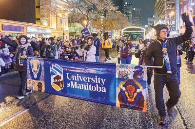 Employees at the University of Manitoba represent the school during the community’s annual Santa Claus Parade.