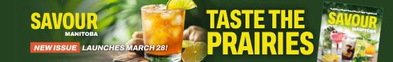 Iced drink with lime on a wooden surface beside the Savour Manitoba magazine cover.