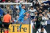 Portland Timbers goalkeeper James Pantemis (41) makes a save as Vancouver Whitecaps' Mathias Laborda (2) watches during the first half of an MLS match in Vancouver, on Saturday, April 4, 2026. THE CANADIAN PRESS/Ethan Cairns