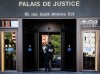 Two Quebec men have been barred from donating sperm in the province after being accused of fathering hundreds of children. A police officer carries paperwork into the Palais de Justice, Quebec Superior Court, in Montreal on Monday, Aug. 18, 2025. THE CANADIAN PRESS/Christinne Muschi