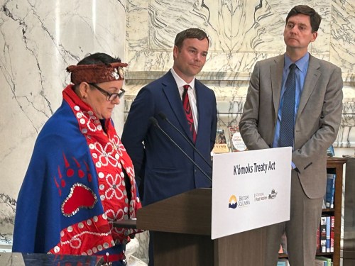 K'omoks First Nation Chief Nicole Rempel speaks at an event to mark the tabling of treaty implementation legislation, as B.C. Premier David Eby, right, and Spencer Chandra Herbert, Minister of Indigenous Relations and Reconciliation look on, in Victoria, on Tuesday, April 14, 2026. THE CANADIAN PRESS/Wolfgang Depner