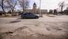 MIKE SUDOMA / FREE PRESS FILES
                                Drivers avoid the long line of potholes at the corner of Broadway and Memorial Boulevard.