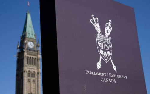 A sign is seen on Parliament Hill near the Peace Tower in Ottawa, Wednesday, April 8, 2026. (Adrian Wyld / The Canadian Press)
