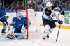 Connor Hamilton / The Associated Press
                                Winnipeg Jets centre Mark Scheifele passes the puck in front of St. Louis Blues goaltender Jordan Binnington during the Jets 3-2 win over the Blues, Thursday in St. Louis. Scheifele is now just 1 point shy of 100 for the season.