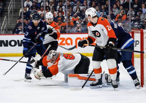 JOHN WOODS / THE CANDIAN PRESS
                                Philadelphia Flyers goaltender Dan Vladar (80) makes a save against the Winnipeg Jets during the second period in Winnipeg on Saturday.