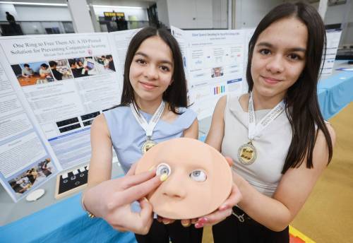 JOHN WOODS / FREE PRESS
                                Sisters Miriam and Ruth Turk show off their gold-medal-winning project on developing a 3-D printed solution for preventing conjunctival scarring during the 55th annual Manitoba Schools Science Symposium.