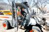 Mayor Scott Gillingham is all smiles as he operates a Toolcat outfitted with a broom, with the help of neighbourhood action team member Blair Stewart, during the spring clean-up launch in Old Market Square Wednesday. (Ruth Bonneville / Free Press)